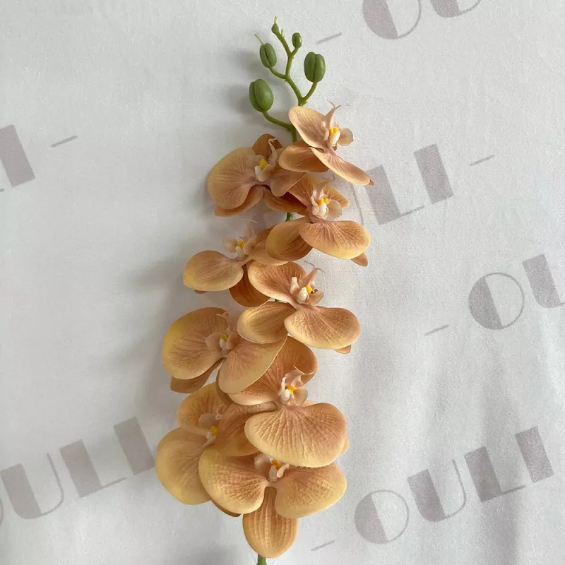 decorative faux orchid arrangement